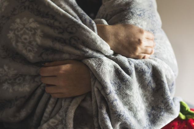 person covered in blanket